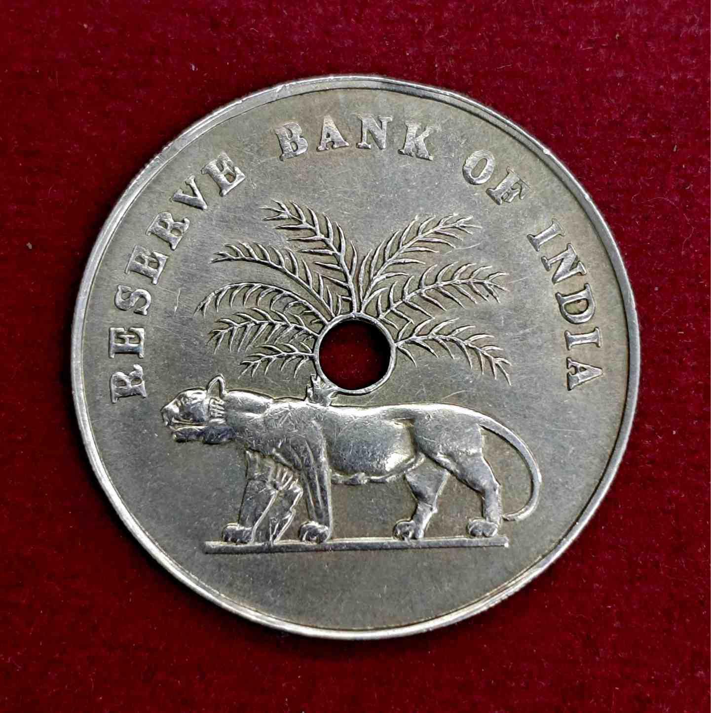 Token :- 1976 – Reserve Bank of India DQ Hole Token (Token No: RBI-DQ-1976-01) – Tiger Design