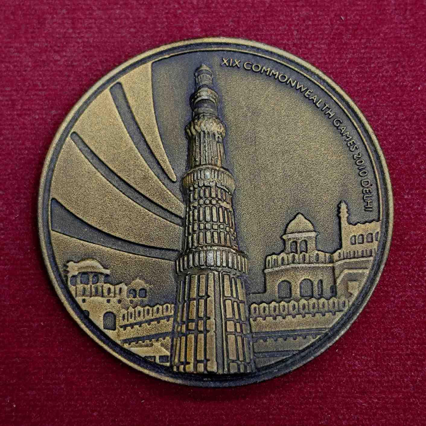 Medal :- Delhi 2010 XIX Commonwealth Games Commemorative Medal – Qutub Minar Design – Bronze Finish – India