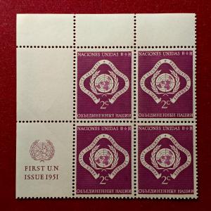 Stamp :- United Nations 1951 First Issue Stamp 2¢ Block of Four – Featuring “Peace, Justice, and Security” Emblem with Margin Inscription “FIRST U.N. ISSUE 1951”